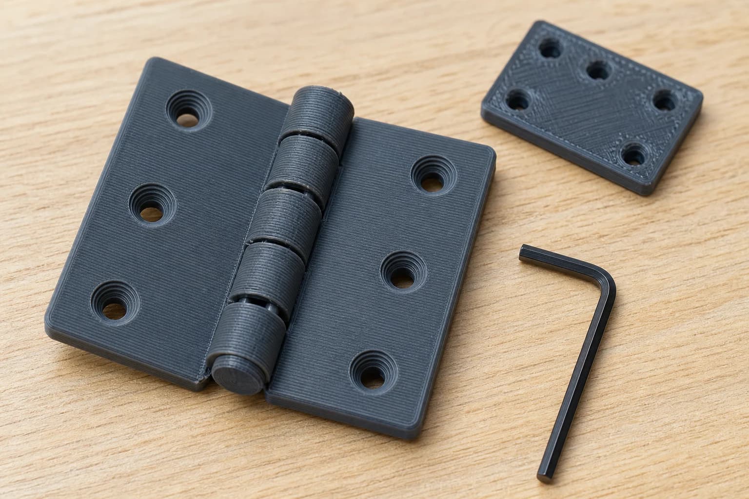 Five-knuckle print-in-place PETG hinge open on a workbench